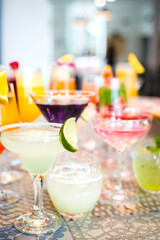 Selection of Colorful Alcoholic Cocktails Drinks on Bar, Vertical View