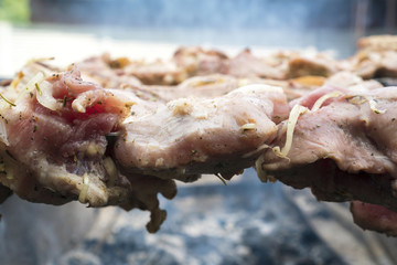 Skewers of pork or meat fried on a barbecue on the grill, barbecue