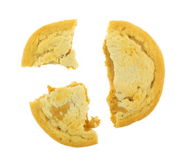 A broken chunky peanut butter cookie isolated on a white background.