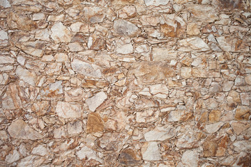 Decoration texture. Stone fences. Close-up of colorful old stone wall surface, background. Interior or exterior design detail 