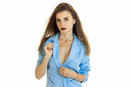 young beautiful business woman in blue jacket without bra