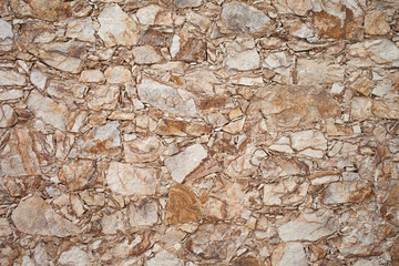 Colorful old stone wall texture, background. Stone fences. 