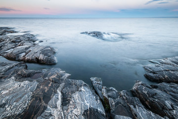 Obraz premium Tranquil morning minimalist landscape of stony coast