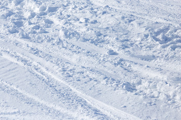 Traces of skis on snow as background