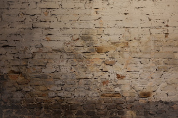 old dirty weathered brick wall with chalk paint remains