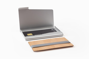 Metal and wooden business card holders with black credit card