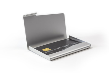 Obraz na płótnie Canvas Metal business card holder with black credit card