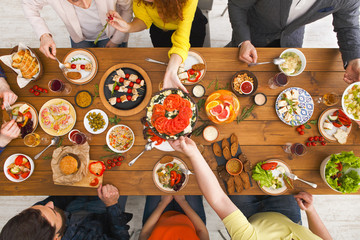 People eat healthy meals at served table dinner party