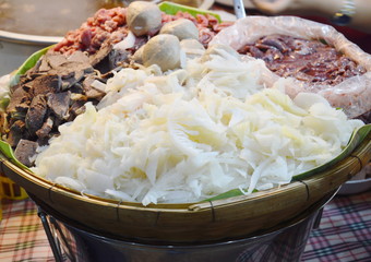 mixed beef entrails ingredient food in bamboo basket on market