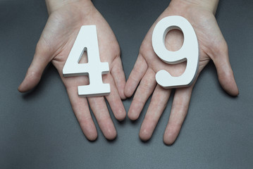 To female hands the number forty-nine.