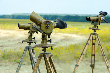 Military binoculars on the ground for parachutists
