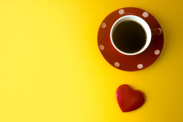 love red heart with coffee cup on yellow ground
