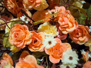Fake roses in a variety of colors.