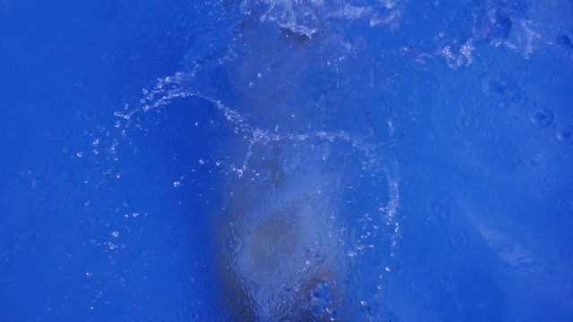 High Angle of Teenager in Plunge Pool, Slow Motion