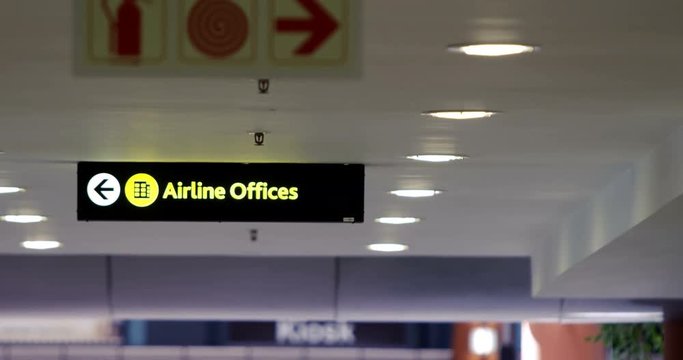 Directional signs at airport terminal
