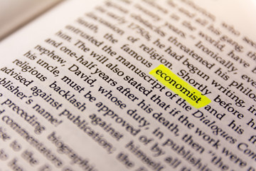 Fototapeta premium Book Highlighted Word Yellow Fluorescent Marker Paper Old Keyword Economist