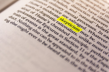 Fototapeta premium Book Highlighted Word Yellow Fluorescent Marker Paper Old Keyword Skepticism