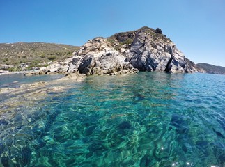 Fototapeta premium Crystal clear water in Cavoli beach, Elba island, Italy