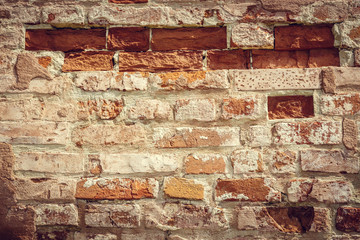 Red Clay Cracked Brick Wall Old Texture. Brickwork Backdrop. Brown White Stonewall Surface. Broken Retro Brickwork Structure.