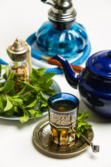 Fototapeta na wymiar Traditional Arab mint tea, white background