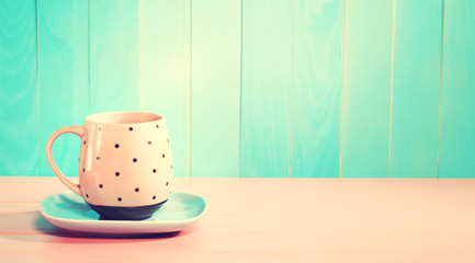 Coffee mug on a bright pastel pink and blue background