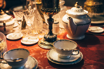 Set of vintage dinnerware on red table