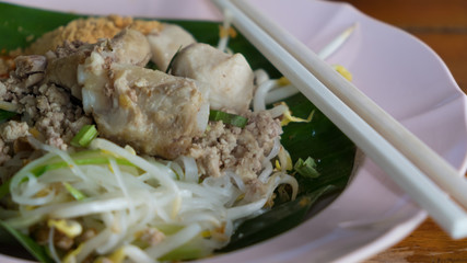 Noodles served “dry” with pork.