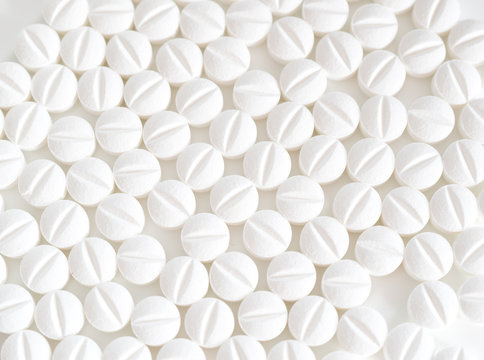 Pile Of White Pills On White Background