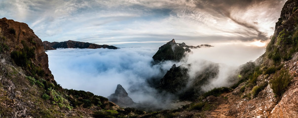 Hiking trail in the mountains above the clouds of Madeira, Portugal