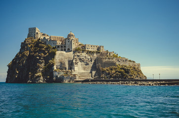 Fototapeta na wymiar Ischia Ponte with castle Aragonese in Ischia island, Bay of Naples Italy