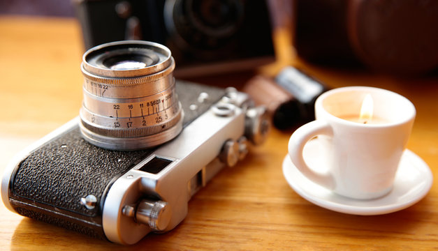 Vintage camera on wooden table
