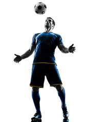 Fototapeta na wymiar one caucasian soccer player man playing in silhouette isolated on white background