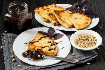 Grilled cheese, served with onion jam and Siberian pine nuts