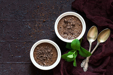 Delicate chocolate dessert with cream and dried prunes