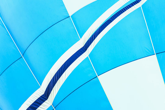 Close-up of hot air balloon vivid texture and pattern, blue-white colors. With place for your text, for modern background