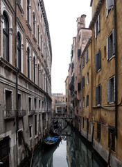 Fototapeta na wymiar venice canal and buildings in muted colours bridge and moored boats