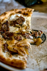 Delicious looking pizza in a restaurant setting 
