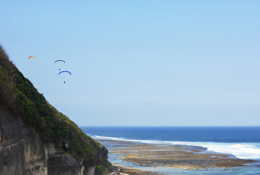 Paraplanes in the sky, Bali landscape.