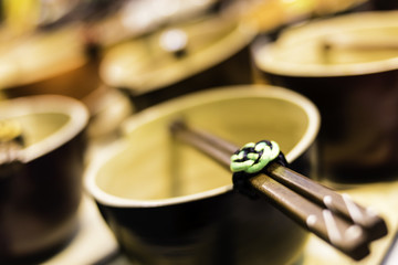 Closeup on traditional chinese teapot and stick
