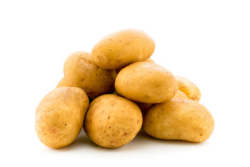 A bunch of young potatoes on white