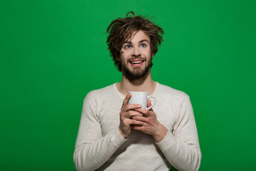 happy man with cup of tea or coffee