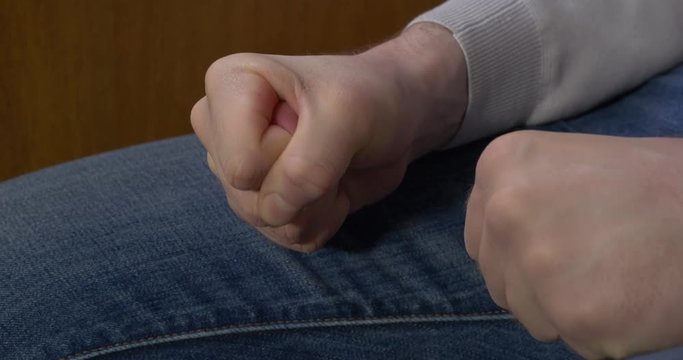 Man clenched fist. Man clenches his fist when his chastises the chief