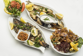 Grilled Fish with Lemon Slices & Traditional Lebanese salads