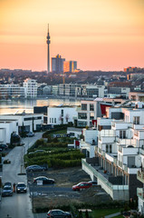 a viewpoint from Phoenix-See over Dortmund skyline and the Florian Tower at sunset - obrazy, fototapety, plakaty