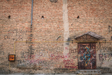 Brick wall background with door
