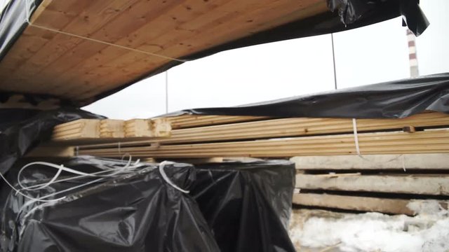 Storage timber. Lumber yard.factory use for construction wood industry.Stock of timber wood construction in warehouse