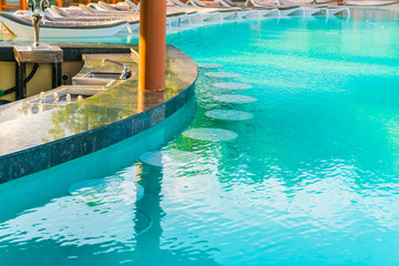 Swimming pool bar in tropical Maldives island .