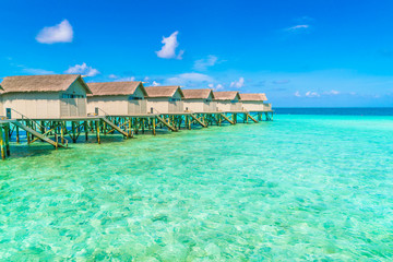 Beautiful water villas in tropical Maldives island  .