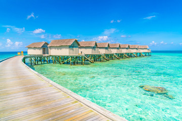 Fototapeta na wymiar Beautiful water villas in tropical Maldives island .