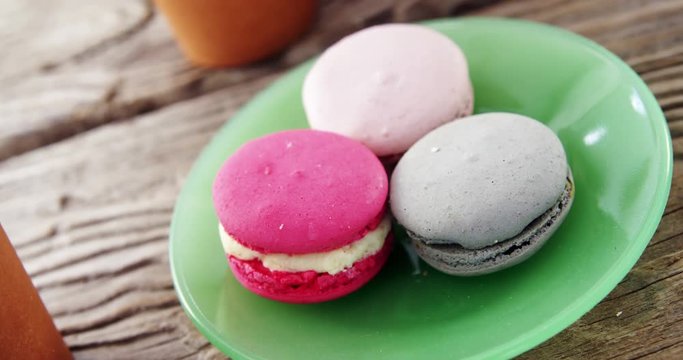 Colorful macaroon cookies in plate